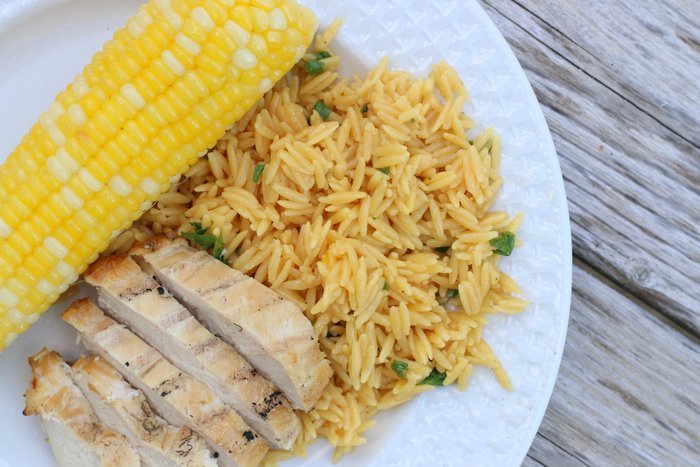 FashionablyEmployed.com | Easy weeknight dinner perfect for the grill: Grilled chicken, saffron orzo and corn on the cob. | A simple recipe for busy moms long on ambition and short on time!