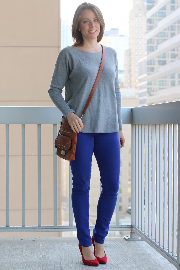 FashionablyEmployed.com | Simple, sustainable, chic style for the everyday professional woman | Cobalt jeans with gray sweater and pop of red from heels, unexpected color combination for Casual Friday at the office | perfect for work, office style for women