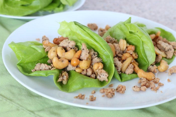 Cashew Chicken Lettuce Wraps: Need a quick, easy and healthy lunch or dinner idea? This can be prepared over the weekend and thrown together in a few minutes to satisfy the whole family.