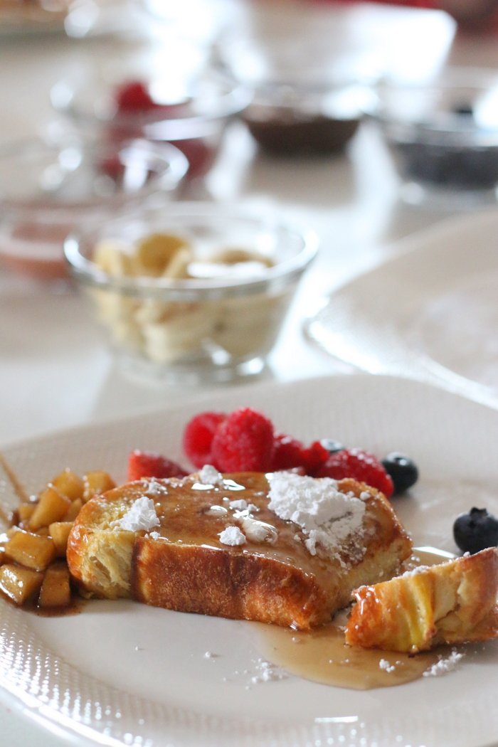 Need an idea for a fun and fancy breakfast or brunch without the fuss? Check out this easy French Toast Bar even the most basic culinary skills can master. Click through for tips, toppings ideas, and more.