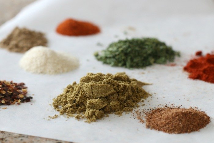 piles of spices on parchment paper