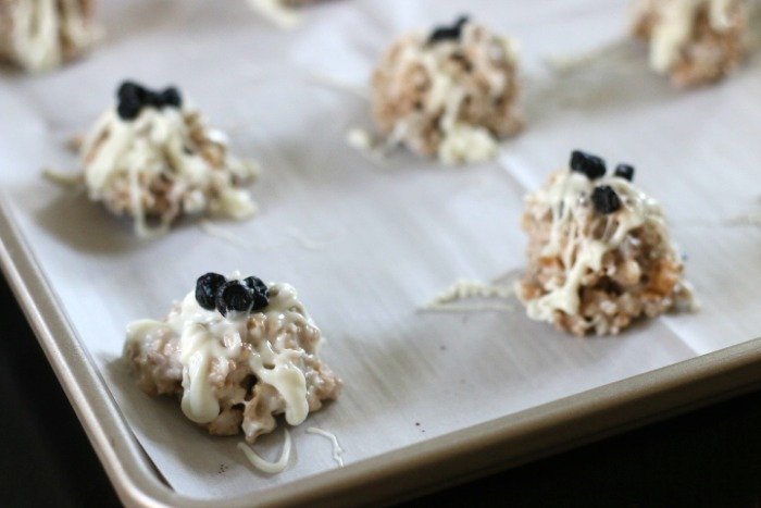 blueberry white chocolate clusters on a tray to cool