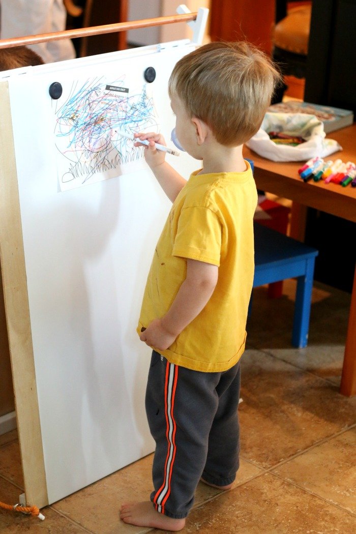 little-boy-coloring-on-a-handmade-easel