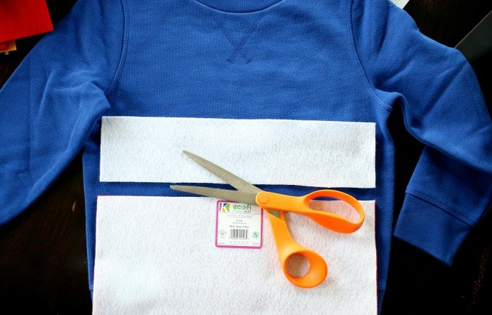 cutting-felt-over-blue-sweatshirt