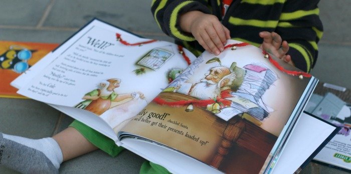 little-boy-flipping-through-christmas-put-me-in-the-story-book