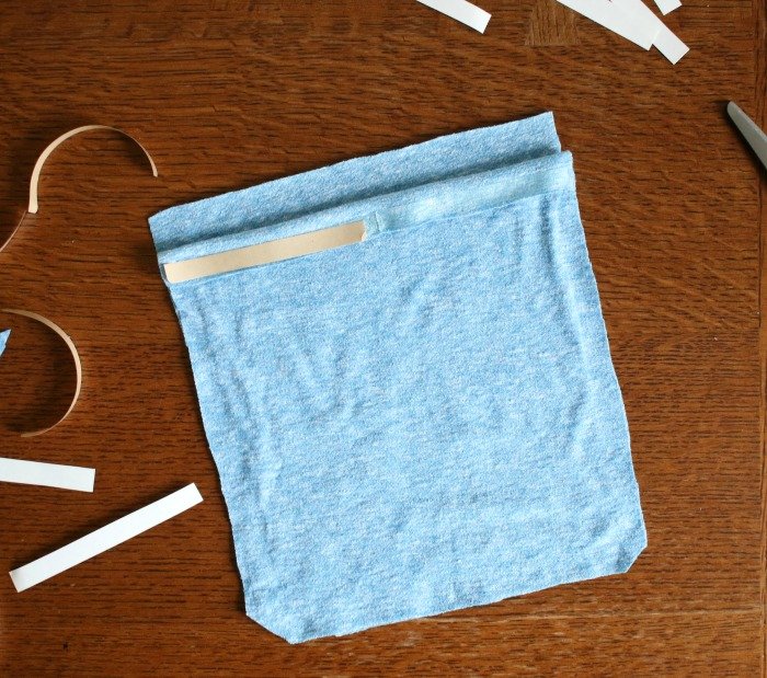 permanent-hem-tape-cut-on-folded-over-flap-of-drawstring-bag