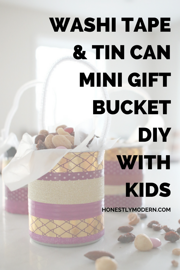 Try this quick and fun upcycled DIY that super easy to do with kids: washi tape, tin can, and a pipe cleaner for a fun and quick mini gift bucket for a friend, teacher or anyone you wish.