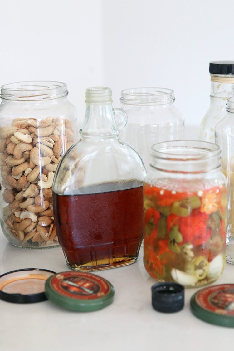 https://www.honestlymodern.com/wp-content/uploads/2020/11/repurposed-glass-jars-on-a-counter.jpg