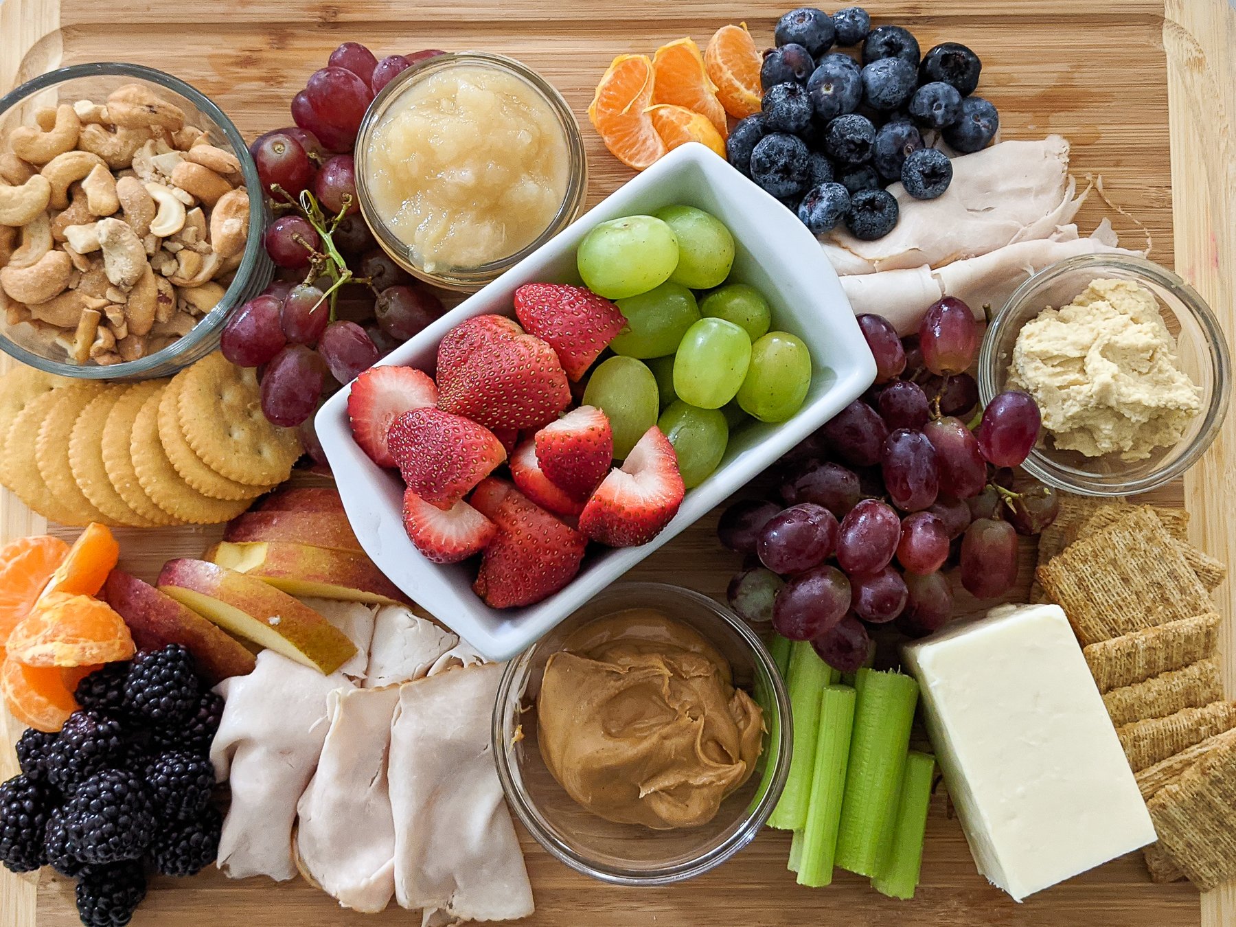 charcuterie board with lots of snacks on it