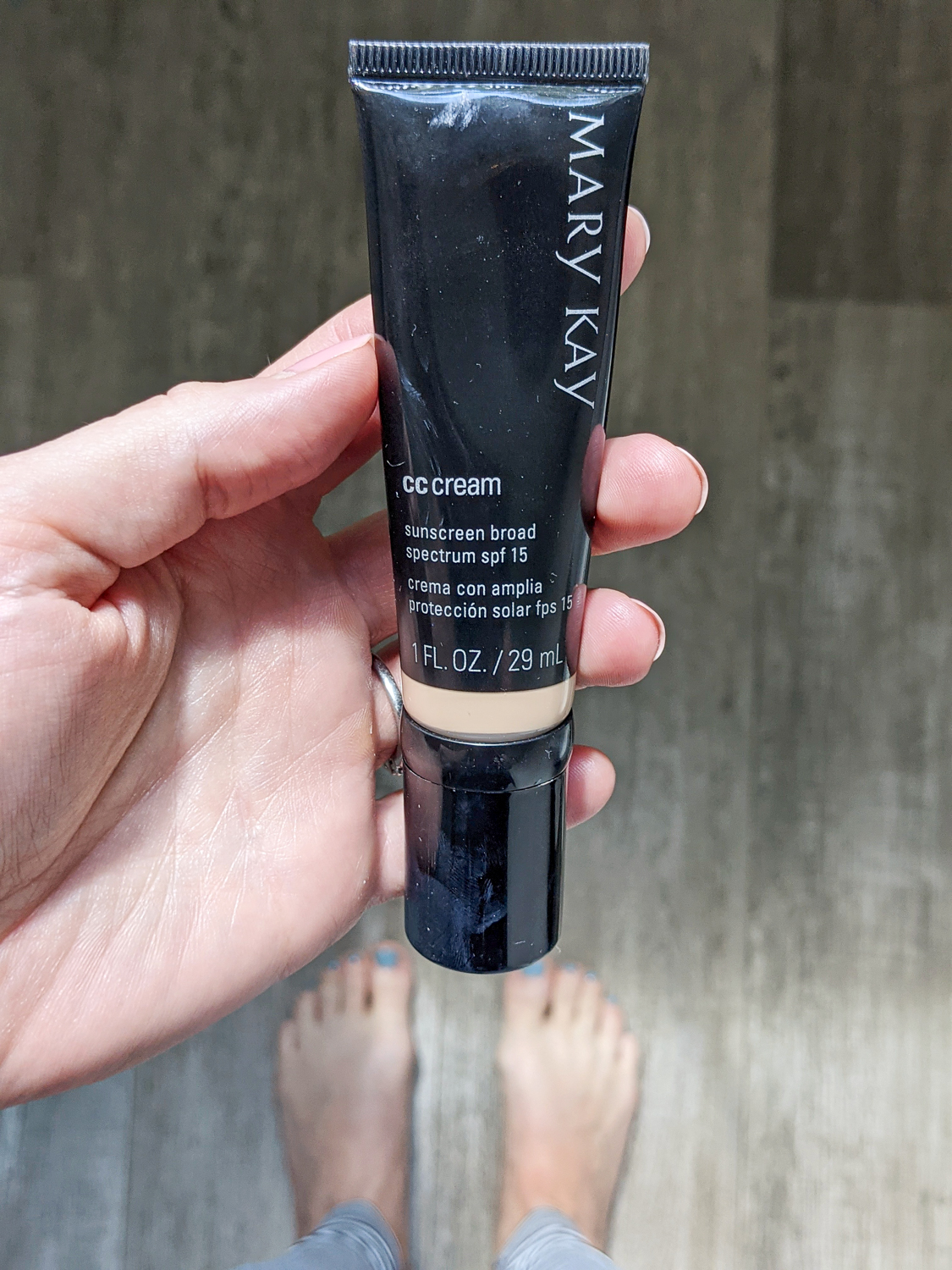 Mary Kay CC cream in a woman's hand