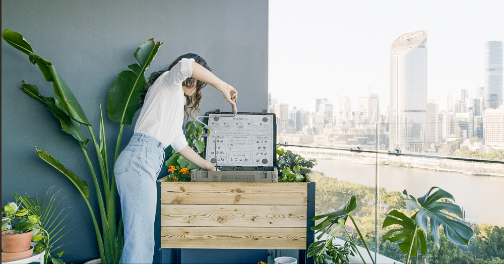 Woman setting up raised garden Modbed