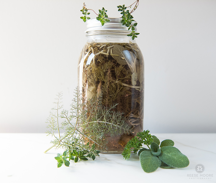 Mixed Herb DIY Scented Vinegar Cleanser in a mason jar