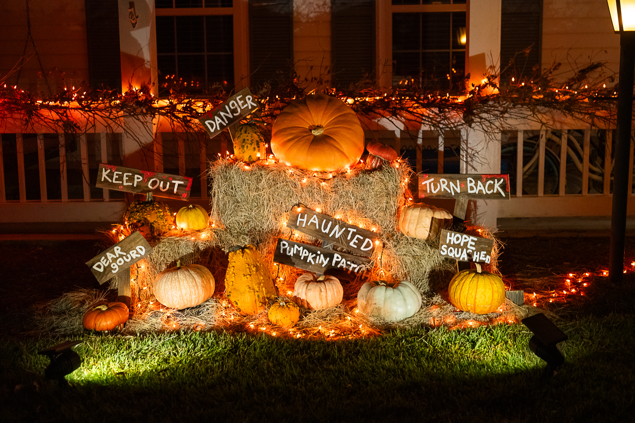 Glass Pumpkin Jack-o-Lanterns on Homemade Hay Bales